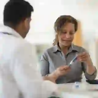 doctor showing patient biologics