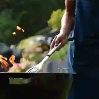 man using BBQ grill
