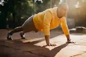 A man does a plank outside