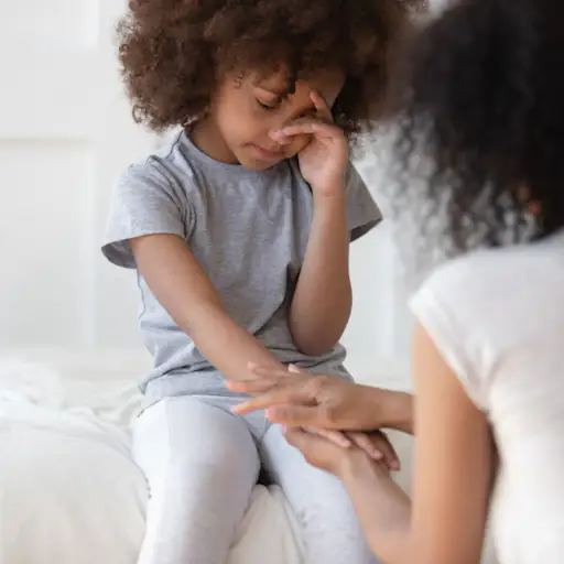 mother comforting daughter
