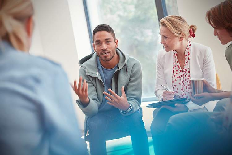 Man talking to a support group