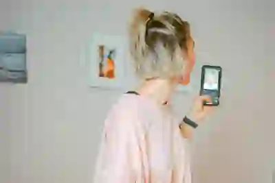 woman in big t-shirt looking at phone