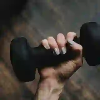woman holding dumbbell