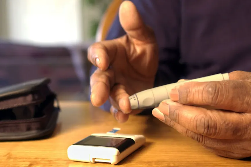 Man using Blood Glucose Meter