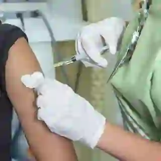 Woman getting flu vaccine image.