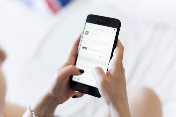 woman's hands holding phone