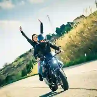 Couple on a motorcycle.
