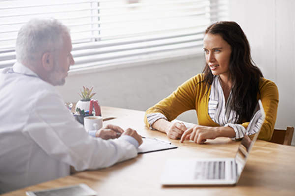 Woman working with her relationship with her doctor.