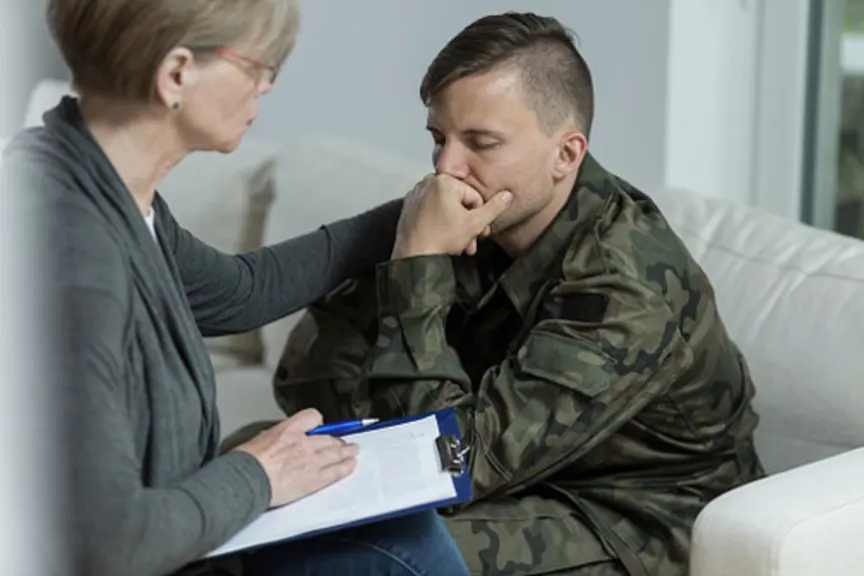 Distressed soldier talking with counselor.