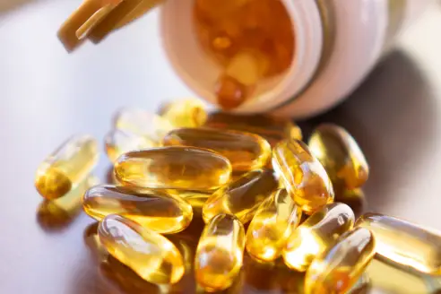 A closeup of vitamin D capsules