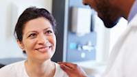 Doctor speaking with woman