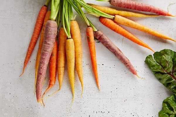 Carrots on white surface