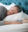 Middle age man sleeping peacefully.