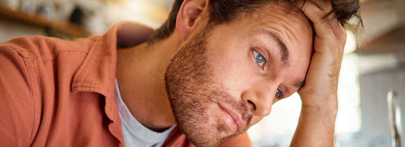 Working from home stressed businessman with hands in hair