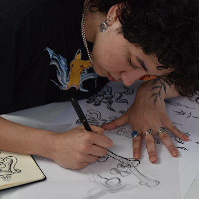 Jade Hermans who makes drawings for tattoos.