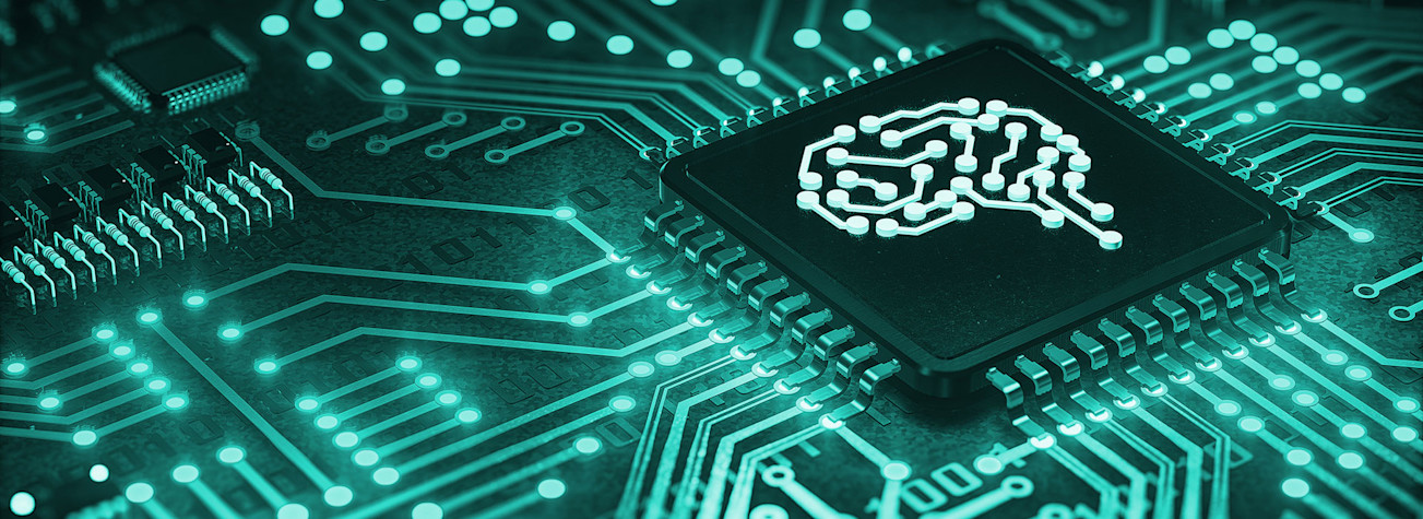 Microchip featuring an illuminated brain-shaped symbol on an electronic circuit board.