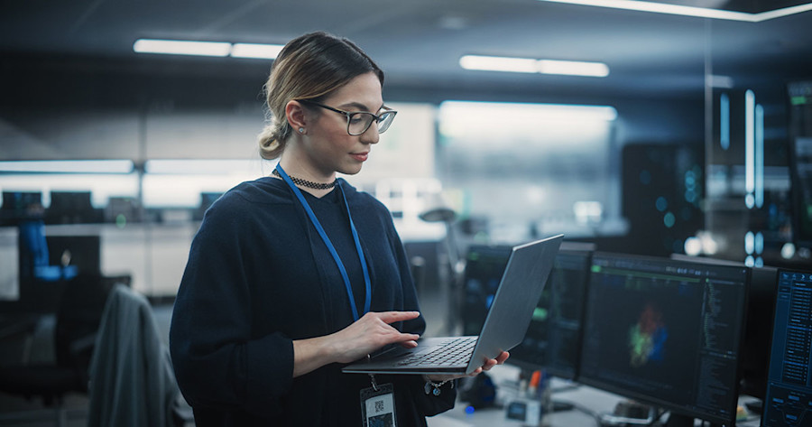 female oftware engineer looking at her laptop