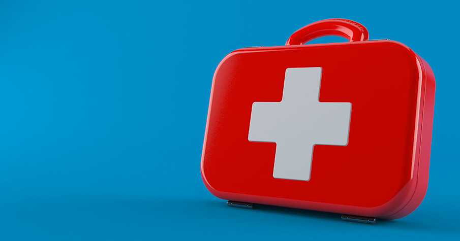 First aid kit against a blue background