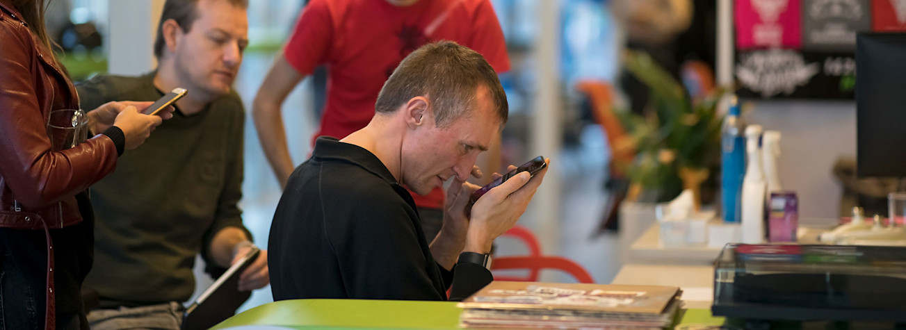 Visually impaired person operates a smartphone