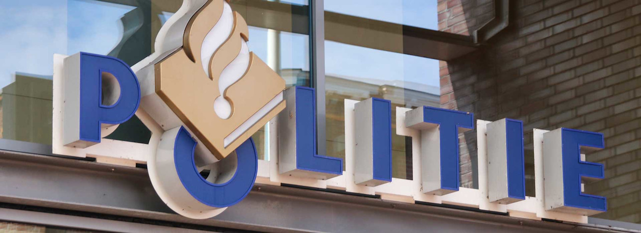 Police logo on the facade of a police station