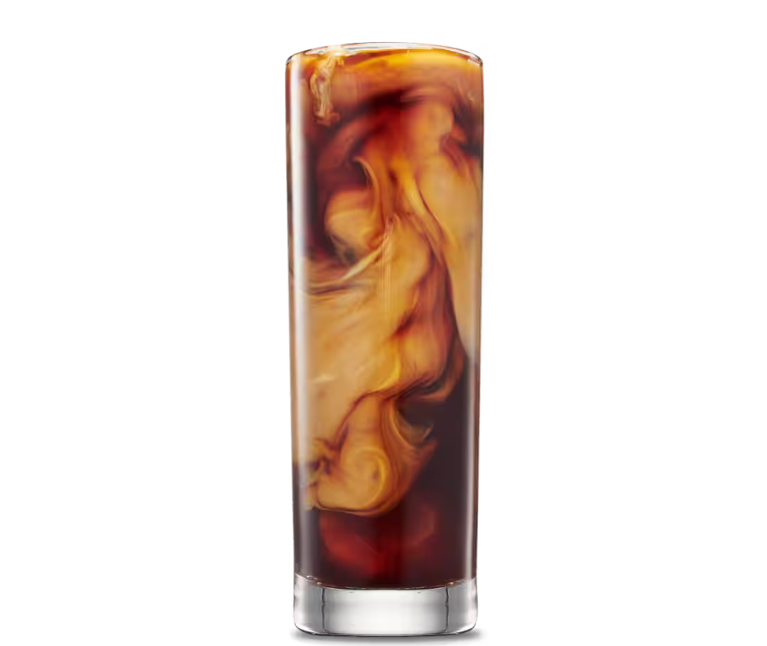 An Iced Oat Latte in a Collins glass with oat milk swirling in Mr Black Coffee Liqueur