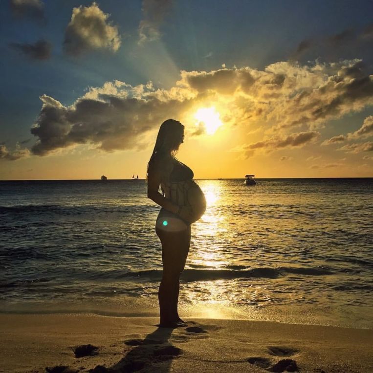 rachel pregnant on beach sunset