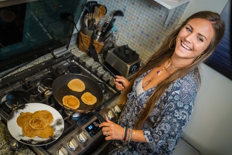 rachel-brathen-cooking-pancakes-family.jpg