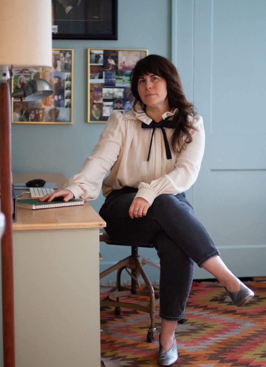 Alea sitting at a desk
