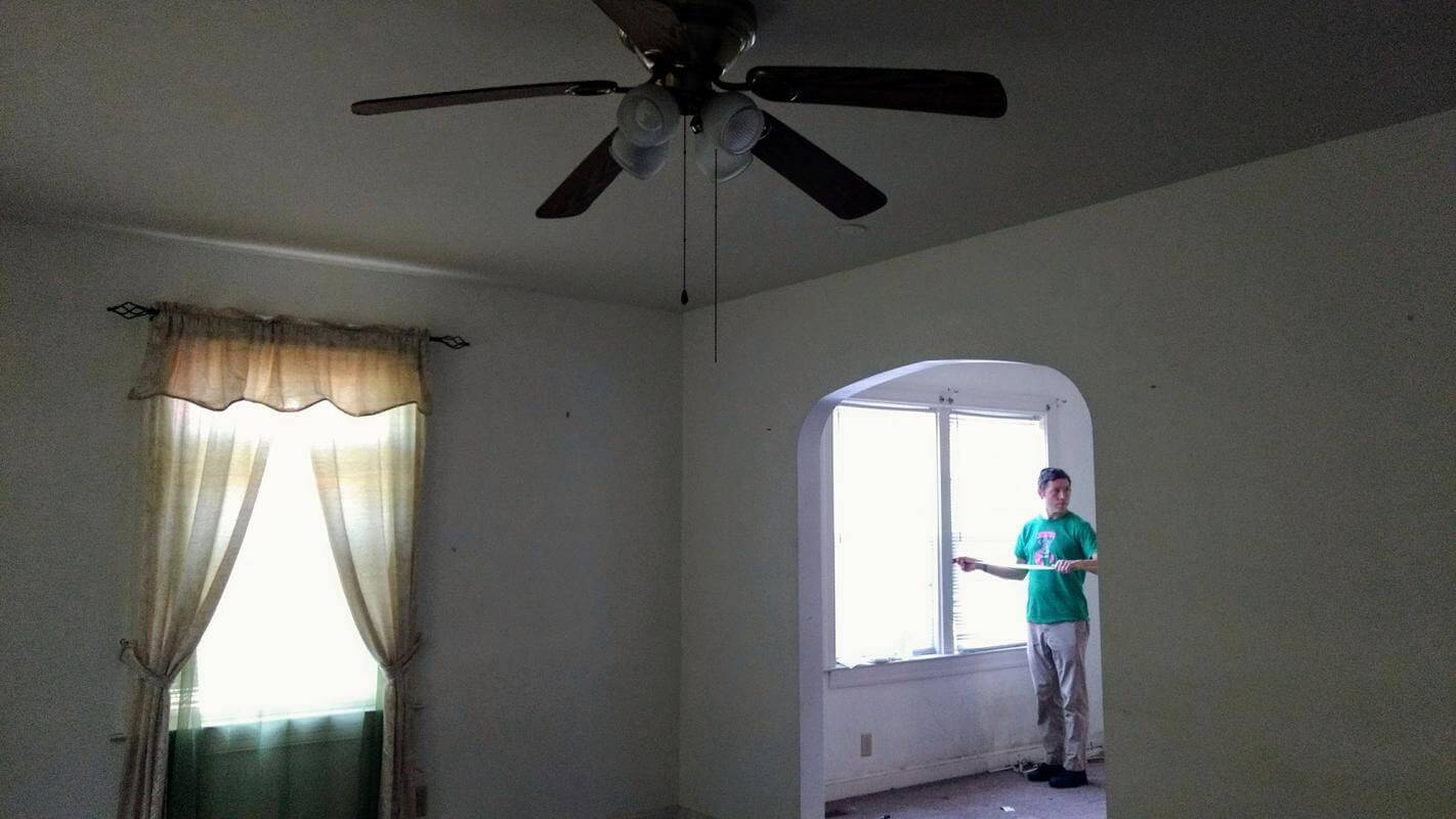 Living room after removing furniture and before window treatments