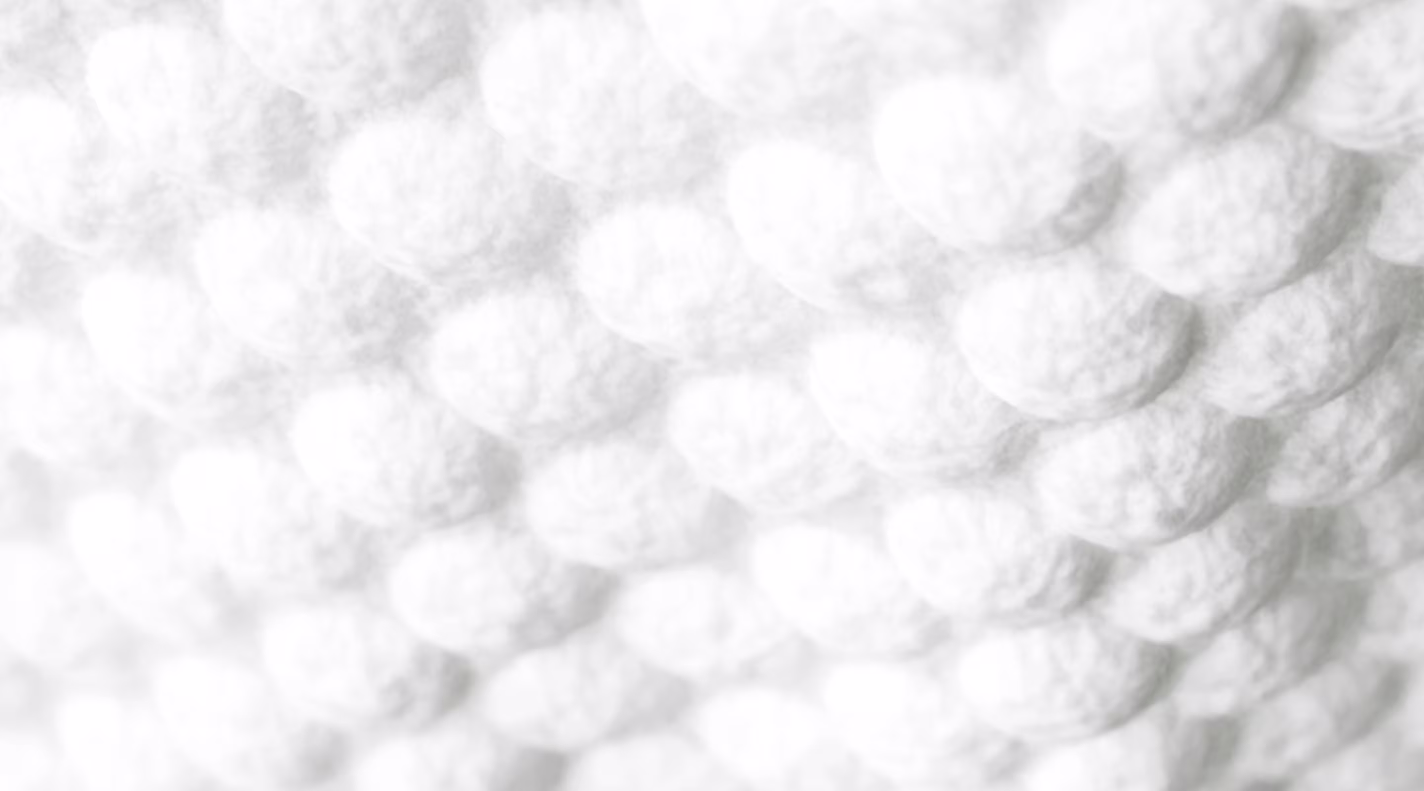 Imagine în care se arată de aproape textura de pernuțe moi a noilor șervețele Pampers Aqua Soft Touch.​