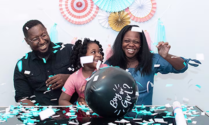 Family photo with a twist gender reveal