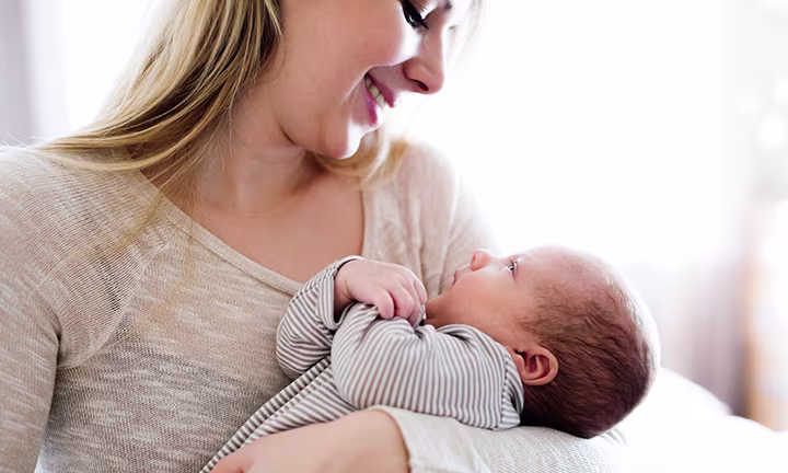When do babies hold their head up