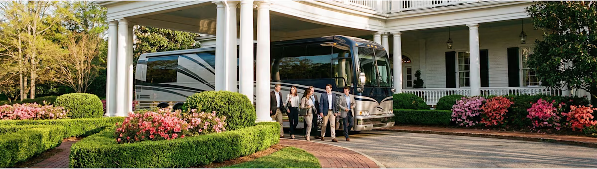 ## Charter Bus Service for The Masters 2026 in Augusta – Effortless Travel for Large Groups
Bookinglane's Charter Bus Service for The Masters 2026 in Augusta is built for larger groups that need coordinated, reliable transportation throughout tournament week.
Our charter bus service includes the Mini Coach (up to 28 passengers), the Mid-Sized Motorcoach (up to 35 passengers), the Executive Coach (up to 56 passengers), and the Limo-Style Bus (up to 50 passengers). Whether you are moving a corporate hospitality group, a private club outing, or a multi-family patron party, there is a vehicle that fits your headcount and your expectations.
All charter buses feature comfortable seating, climate control, and generous luggage storage. Your professional chauffeur manages traffic routing, road closures, and approved drop-off access — delivering your group as close to the entrance as permitted. This eliminates the need for general parking areas and long walks, and it removes the coordination burden of trying to move dozens of people in separate vehicles.
Charter buses during Masters week are booked exclusively on an hourly basis, not as round trips. This gives your group the flexibility to adjust pickup times, add stops, and accommodate real-time schedule changes without locking into a rigid departure window. If the final round runs late or a hospitality event shifts, your coach and chauffeur are ready to adapt.
We coordinate charter bus pickups from Augusta Regional Airport (AGS), Hartsfield-Jackson Atlanta International Airport (ATL), and Columbia Metropolitan Airport (CAE). Multi-day itineraries, hotel shuttle loops, off-site event transfers, and evening dining runs throughout Augusta, North Augusta, and Aiken are all customizable to your group's needs.