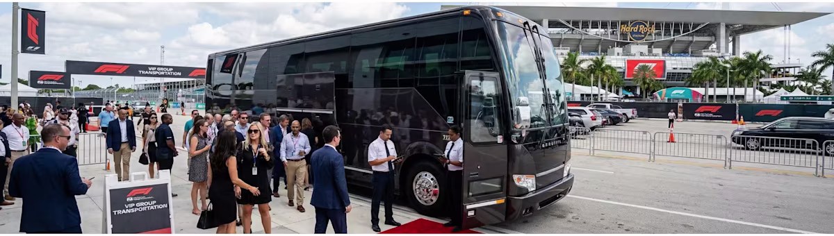 ## Charter Bus Service for the Formula 1 Miami Grand Prix
For large groups, corporate hospitality programs, and official delegations attending the Formula 1 Miami Grand Prix, Bookinglane's Charter Bus Service offers the most comprehensive and scalable group transportation solution available in Miami. Whether you're coordinating the movement of 15 guests or over 50, premium coach options ensure that every passenger travels together in exceptional comfort — arriving at Miami International Autodrome as a unified, well-prepared group.
Charter Bus service is available in four distinct configurations, each tailored to different group sizes and style preferences. **Mini Coaches** accommodate up to 28 passengers and are perfectly suited for smaller corporate groups, VIP delegations, or teams who want an intimate yet polished group travel experience. **Mid-Sized Motorcoaches** accommodate up to 35 passengers, offering a generous blend of comfort and practicality for groups that require a step up in capacity without sacrificing refinement. For the largest corporate delegations and hospitality programs, **Executive Full-Size Coaches** accommodate up to 56 passengers and are appointed with plush seating, climate control, onboard restrooms, and premium amenities designed for extended Grand Prix weekend journeys. For groups that want to combine maximum capacity with an unmistakably luxurious aesthetic, **Limo-Style Buses** accommodate up to 50 passengers and feature striking interior designs, mood lighting, entertainment systems, and upscale furnishings that transform the pre-race journey into an event in its own right.
Our chauffeurs are fully briefed on Miami International Autodrome's access routes, drop-off zones, and surrounding road infrastructure to ensure the smoothest possible arrival and departure experience for your entire group.
With unlimited stops included on all charter bookings, your group has the freedom to incorporate hotel pickups across multiple Miami neighborhoods — from Downtown and Brickell to Miami Beach, Aventura, and Hollywood — into a single, seamlessly coordinated transfer plan. Bookinglane's Charter Bus Service is the definitive choice for organizations that understand how much first impressions and guest experience matter, even before the lights go out on race day.
For groups arriving via Miami International Airport (MIA) or Fort Lauderdale-Hollywood International Airport (FLL), we also offer coordinated airport-to-hotel charter transfers that ensure every member of your party is settled and ready to enjoy the Formula 1 Miami Grand Prix weekend from the very first moment they land.