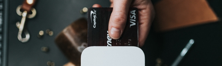 A payment card in use illustrates a story on the Metro 2 format. Courtesy of Nathan Dumlao and Unsplash.