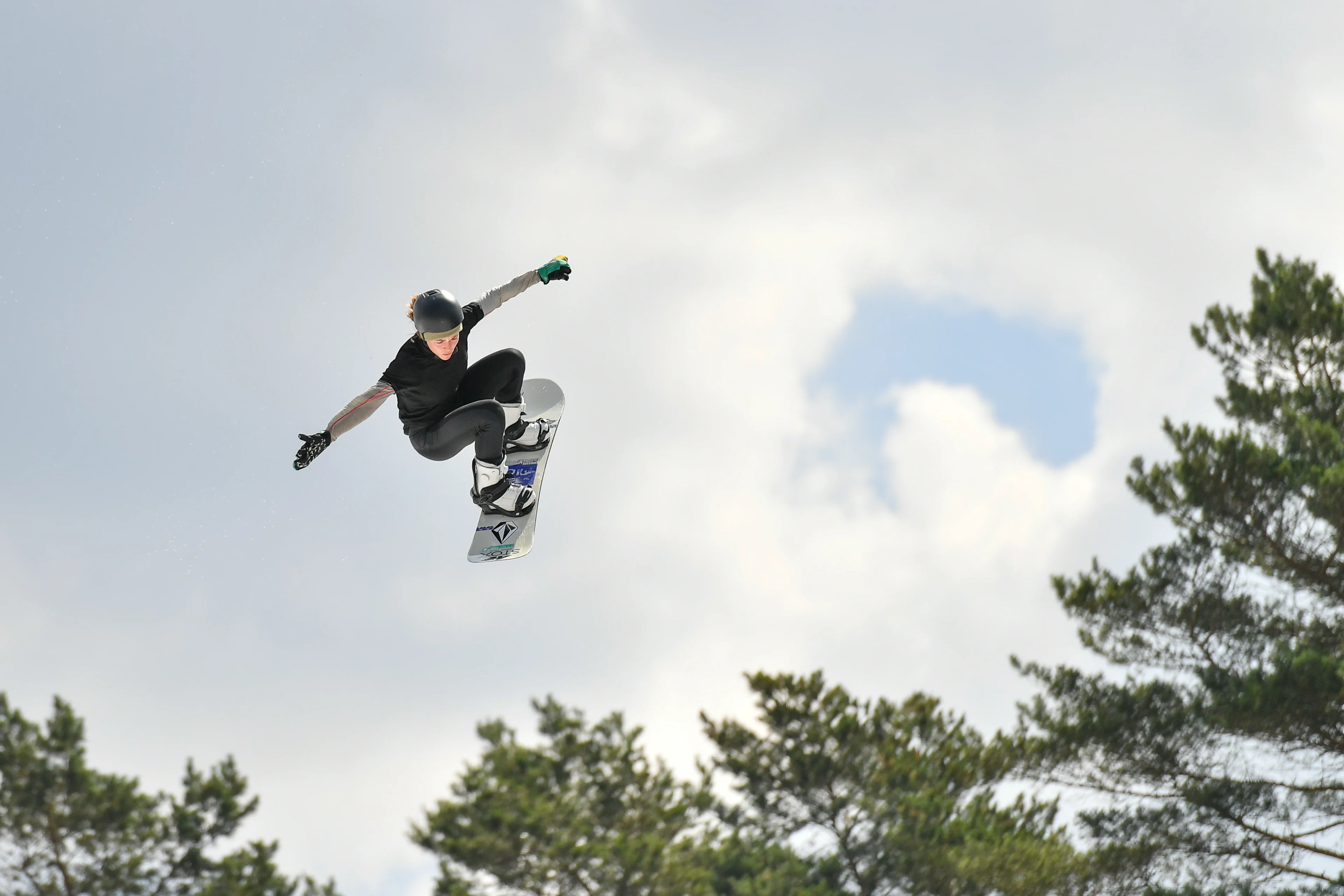 Belgian Snowboarder Loranne Smans pictured in action during the opening of a large dry slope by Flemish minister Weyts, Sport Vlaanderen, the city of Genk and Snow Sports Vlaanderen, in Genk, Saturday 26 June 2021. In a technical sport with very complex movements, the snowboarders and their staff have to look for conditions that allow to perform many repetitions in safe conditions. The dry slope with airbag in Genk makes it possible to train in winter and summer, regardless of the presence of snow. On a track with a height of 34 meters, a length of 62 meters, a slope of 30 degrees and an adjustable 'kicker' (dismount), the riders can imitate every 'Big Air jump' in the world. BELGA PHOTO BERNARD GILLET