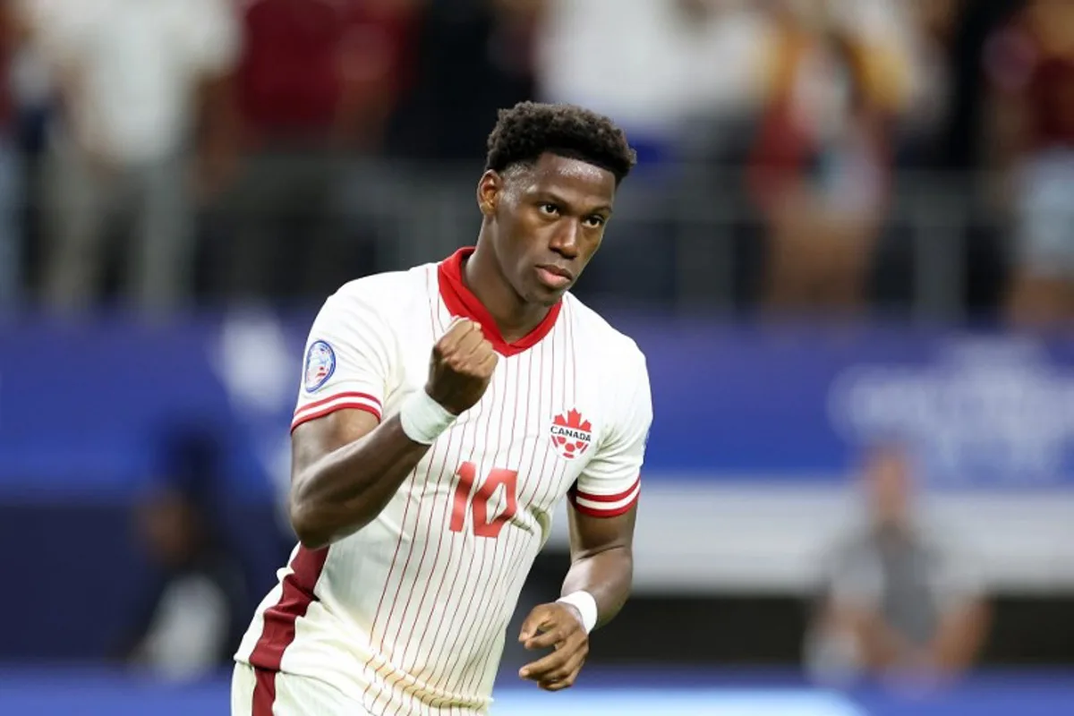 Canada's forward #10 Jonathan David celebrates after scoring in a penalty shoot-out during the Conmebol 2024 Copa America tournament quarter-final football match between Venezuela and Canada at AT&T Stadium in Arlington, Texas, on July 5, 2024. CHARLY TRIBALLEAU / AFP