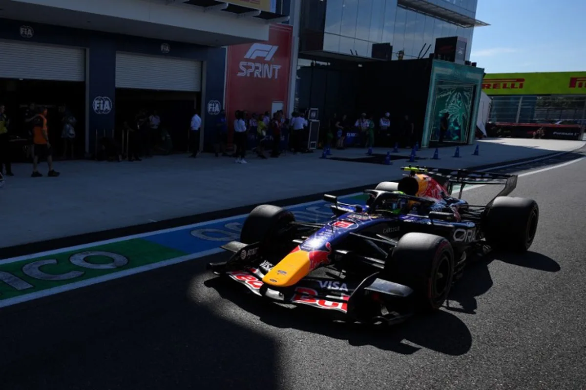 Red Bull Racing's French driver Isack Hadjar steers his car into the pits during the qualifying session for the 2026 Miami Formula One Grand Prix at Miami International Autodrome in Miami Gardens, Florida, on May 2, 2026.   Rebecca Blackwell / POOL / AFP