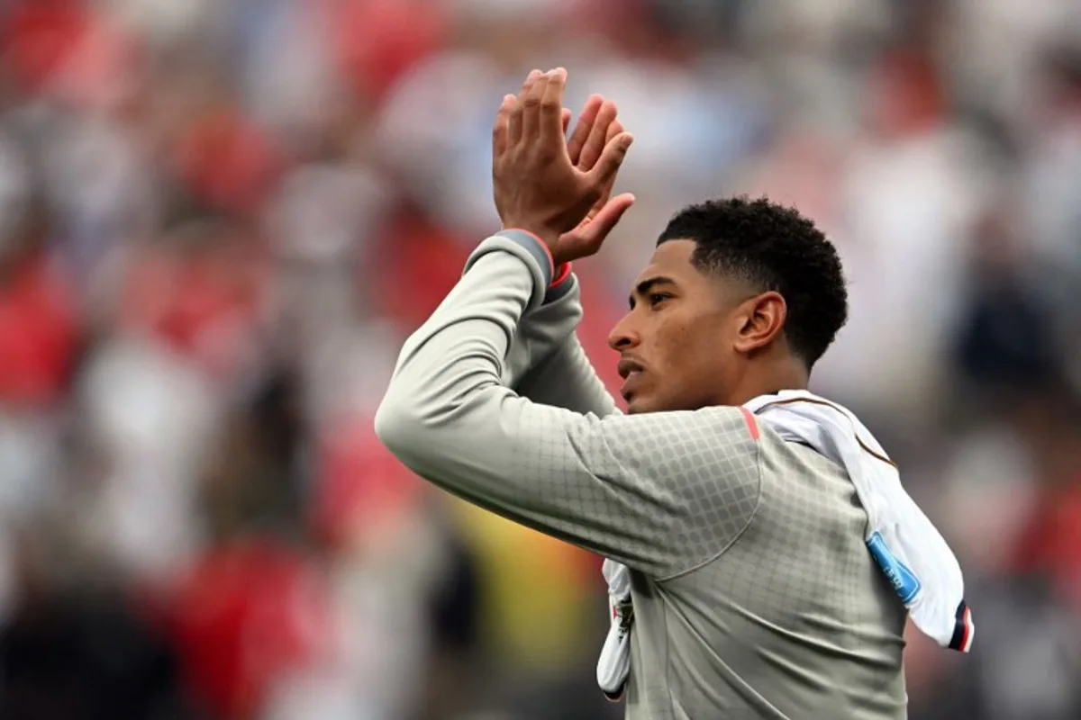 England's midfielder #10 Jude Bellingham greets fans after winning the 2026 World Cup Group L football match between Panama and England at the New York/New Jersey Stadium in East Rutherford on June 27, 2026.   MAURO PIMENTEL / AFP
