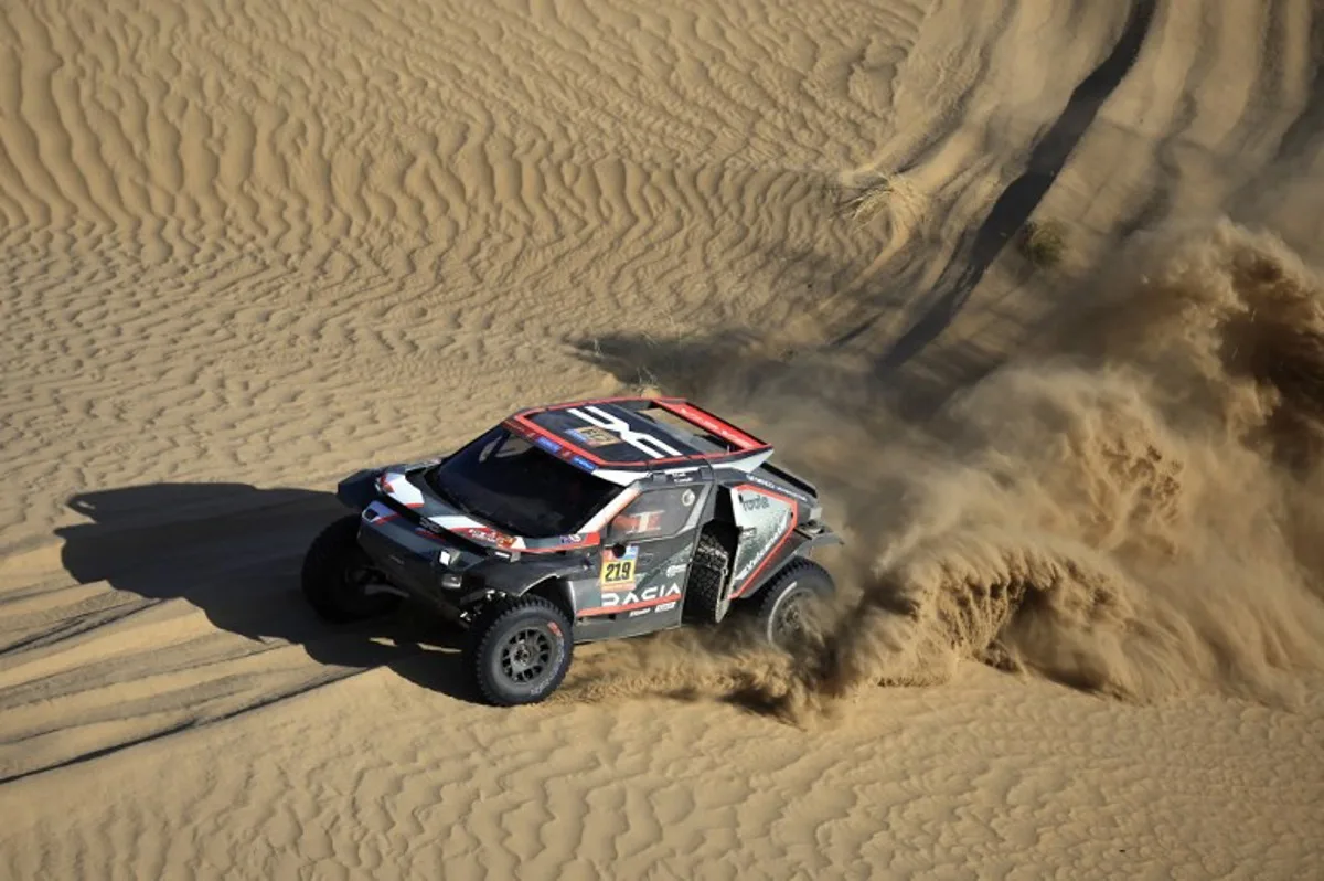 French driver Sebastien Loeb steers his car assisted by co-driver Fabian Lurguin during stage 2B of the 47th Dakar Rally between Bisha and Bisha, on January 6, 2025.  Valery HACHE / AFP