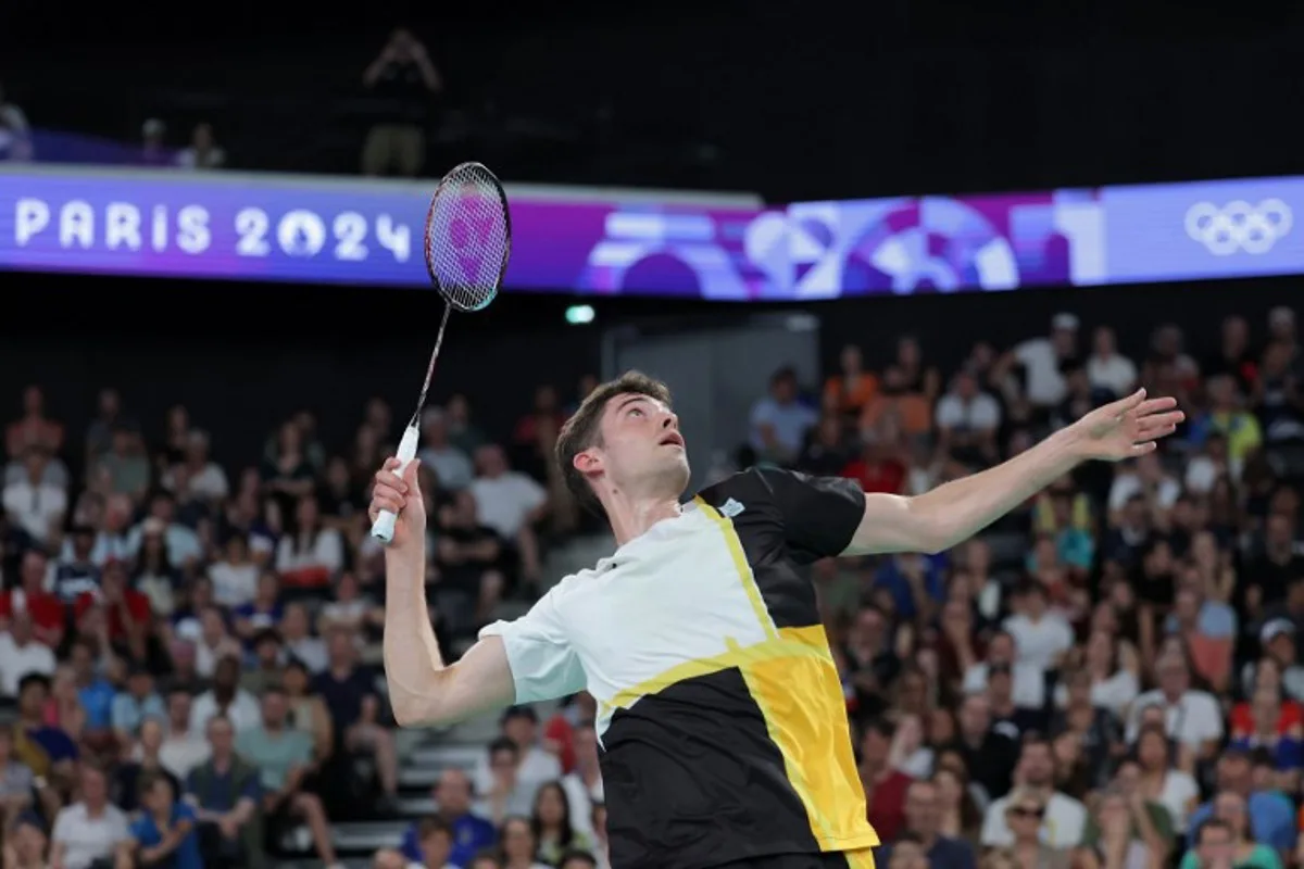 Belgium's Julien Carraggi plays a shot against India's Lakshya Sen in their men's singles badminton group stage match during the Paris 2024 Olympic Games at Porte de la Chapelle Arena in Paris on July 29, 2024.  David GRAY / AFP