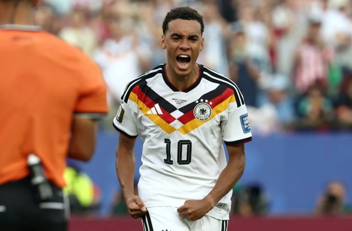 Germany's midfielder #10 Jamal Musiala reacts after scoring his penalty during the penalty shootout of the 2026 World Cup round of 32 football match between Germany and Paraguay at the Boston Stadium in Foxborough on June 29, 2026. FRANCK FIFE / AFP