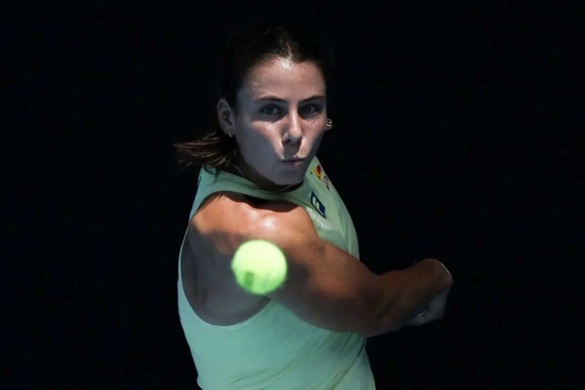 USA's Emma Navarro hits a return to Poland's Iga Swiatek during their women's singles quarter-final match on day eleven of the Australian Open tennis tournament in Melbourne on January 22, 2025.  Martin KEEP / AFP