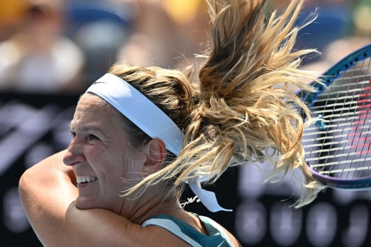 Belarus' Victoria Azarenka hits a return against Italy's Lucia Bronzetti during their women's singles match on day two of the Australian Open tennis tournament in Melbourne on January 13, 2025.  Paul Crock / AFP