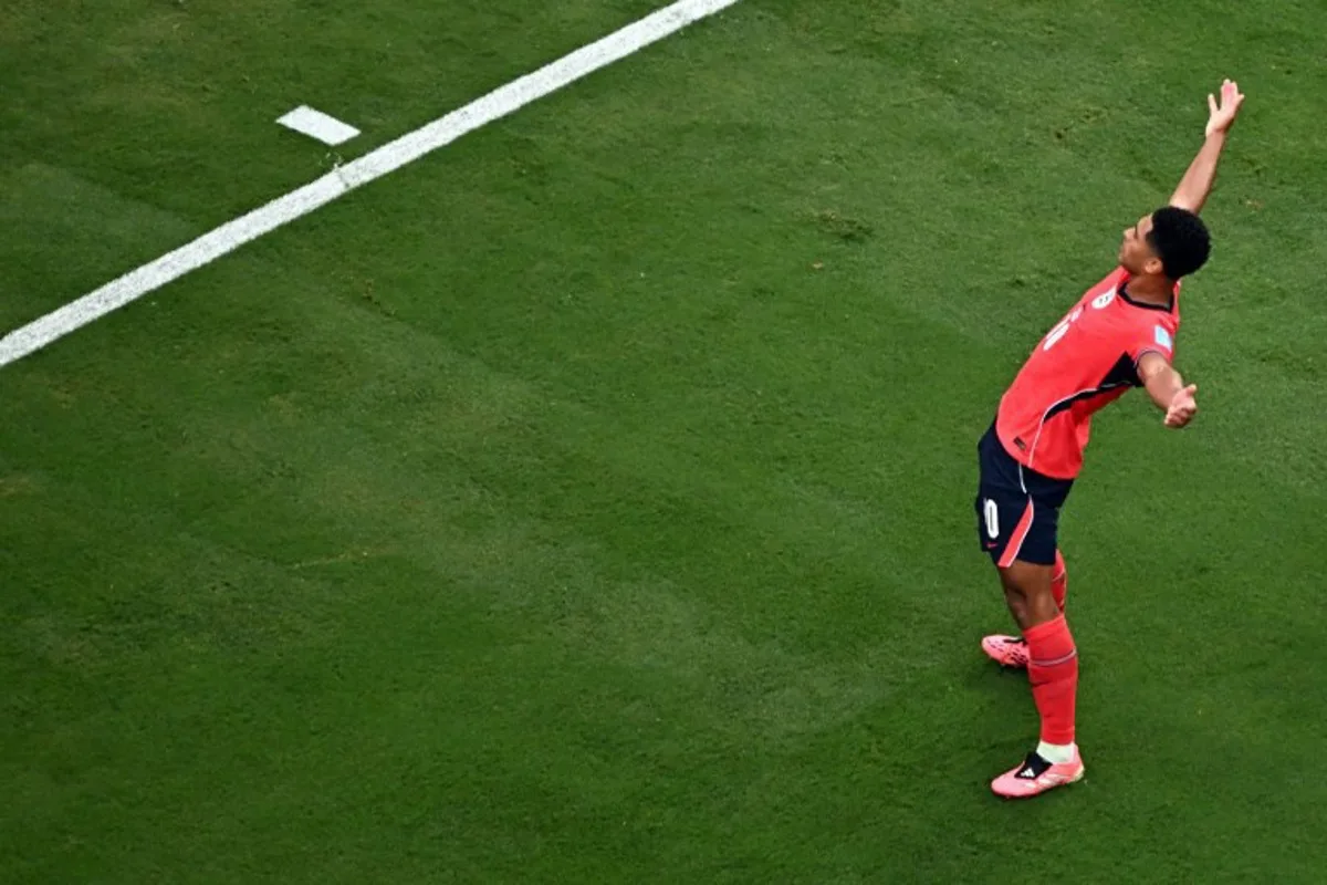 England's midfielder #10 Jude Bellingham celebrates scoring his team's first goal with teammates during the 2026 World Cup Group L football match between Panama and England at the New York/New Jersey Stadium in East Rutherford on June 27, 2026.   Jewel SAMAD / AFP
