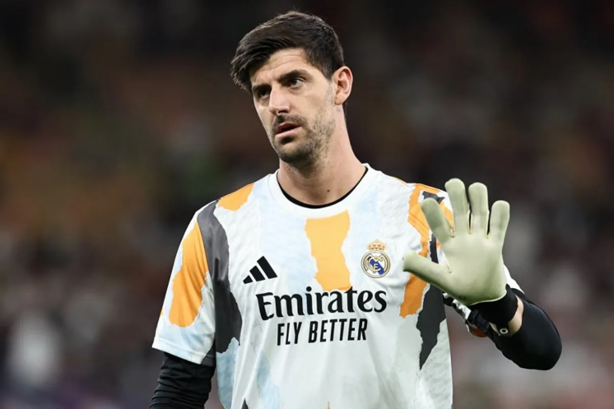 Real Madrid's Belgian goalkeeper #1 Thibaut Courtois warms up ahead of the Spanish Super Cup final football match between Real Madrid and Barcelona at the King Abdullah Sport City in Jeddah on January 12, 2025.  FADEL SENNA / AFP