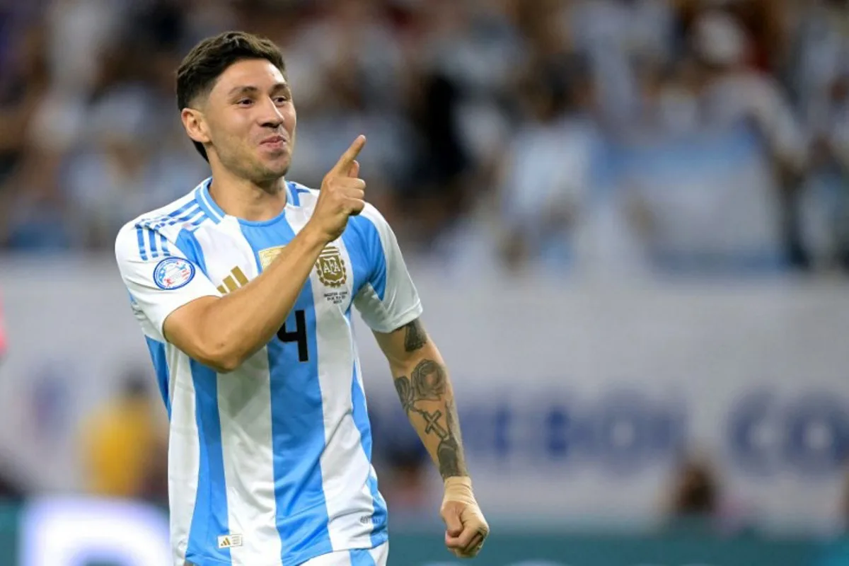 Argentina's defender #04 Gonzalo Montiel celebrates scoring a goal in a penalty shoot out during the Conmebol 2024 Copa America tournament quarter-final football match between Argentina and Ecuador at NRG Stadium in Houston, Texas, on July 4, 2024.  JUAN MABROMATA / AFP