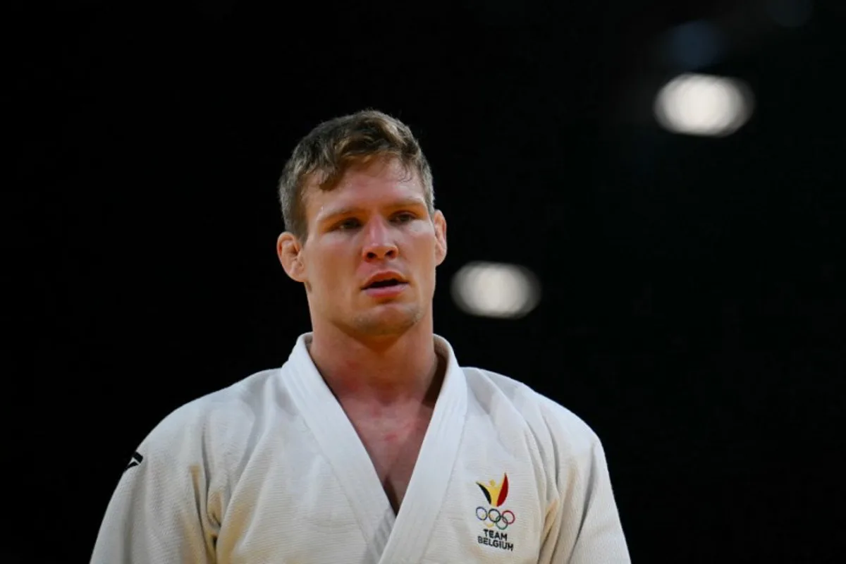 Belgium's Matthias Casse reacts after beating Refugee Olympic Team's Sibghatullah Arab in the judo men's -81kg round of 32 bout of the Paris 2024 Olympic Games at the Champ-de-Mars Arena, in Paris on July 30, 2024.   Luis ROBAYO / AFP