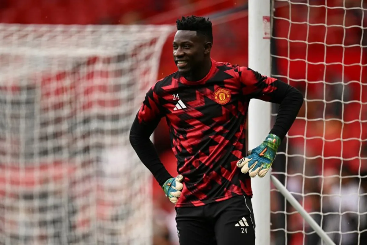 Manchester United's Cameroonian goalkeeper #24 Andre Onana warms up for the English Premier League football match between Manchester United and Burnley at Old Trafford in Manchester, north west England, on August 30, 2025. Oli SCARFF / AFP