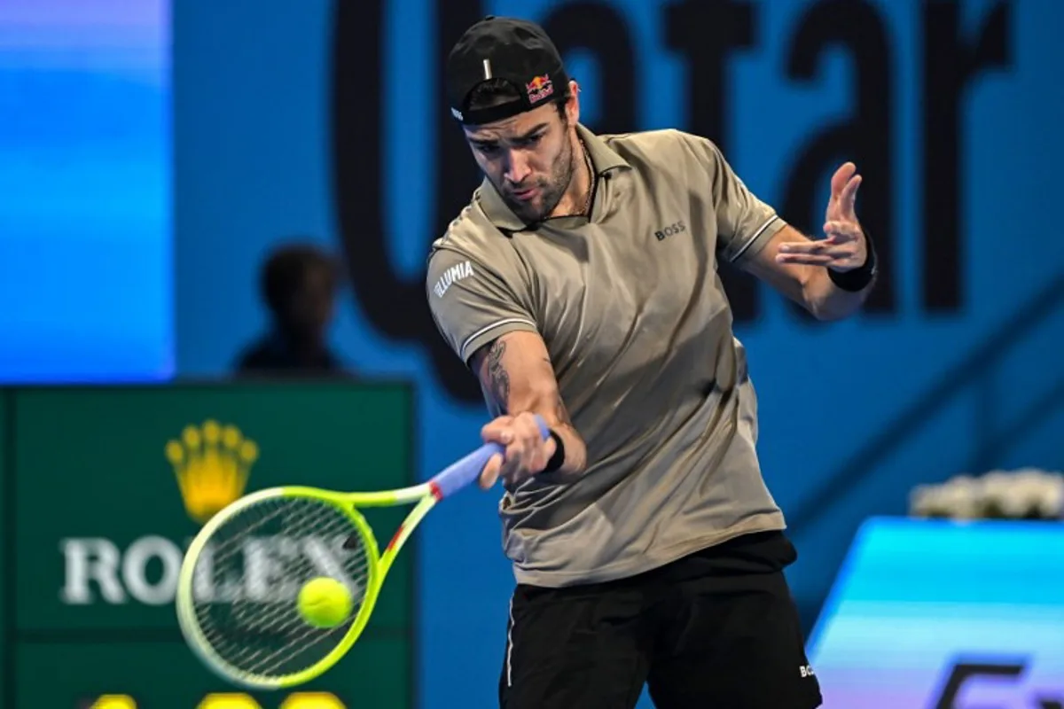 Italy's Matteo Berrettini hits a return to Serbia's Novak Djokovic during their men's singles match at the ATP Qatar Open tennis tournament in Doha on February 18, 2025.  Mahmud HAMS / AFP